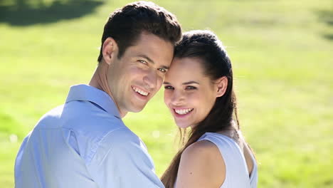 Happy-couple-posing-in-the-park