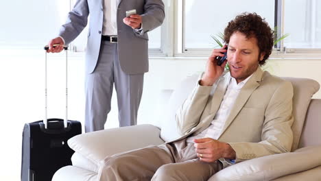 Businessman-answering-his-phone