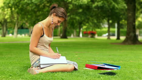 Pretty-student-writing-outside