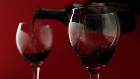 Red-wine-pouring-into-wine-glasses