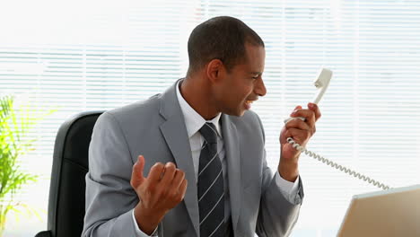 Angry-businessman-shouting-on-the-phone