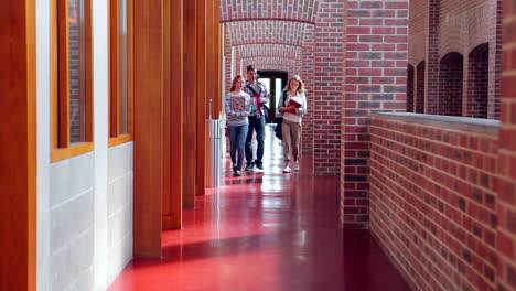 Smiling-students-walking-down-the-hall