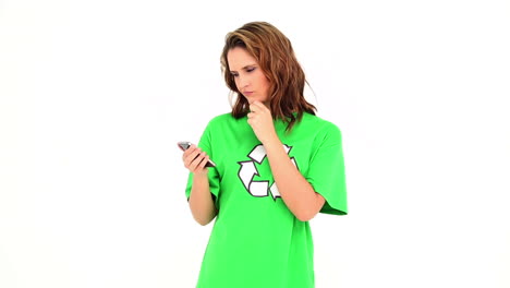 Smiling-environmental-activist-texting-on-mobile-phone