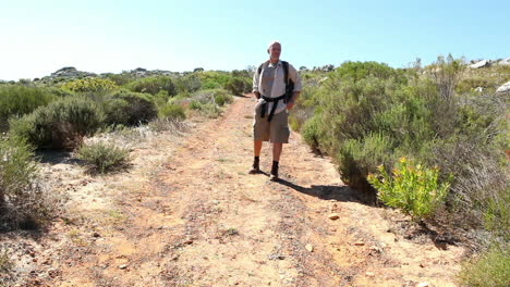 Man-hiking-in-nature-on-wild-trail