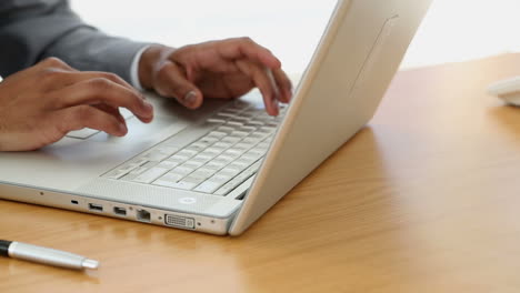 Businessman-typing-on-laptop