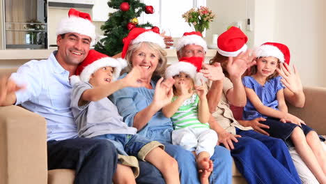 Extended-family-waving-at-camera-at-christmas-time