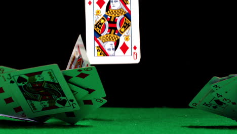 Deck-of-cards-falling-on-casino-table