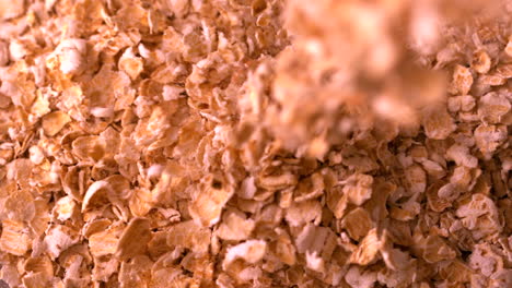 Cereal-flakes-pouring-onto-more