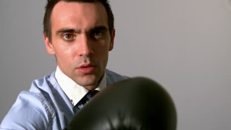 Businessman-punching-with-black-gloves