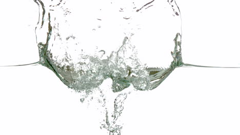 Lime-plunging-into-water-on-white-background