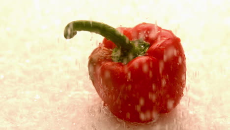 Water-raining-down-on-red-pepper