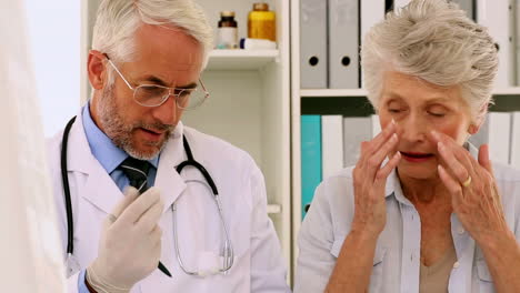Doctor-examining-his-patients-ears