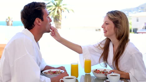 Happy-couple-having-breakfast-together