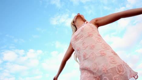 Blonde-woman-spinning-joyfully