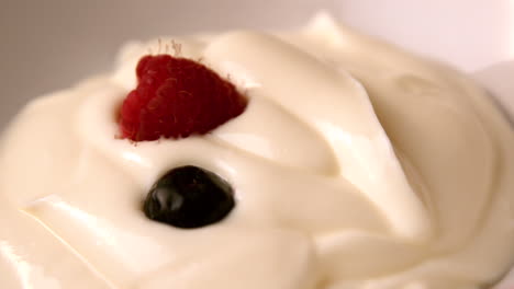 Berries-falling-onto-whipped-cream
