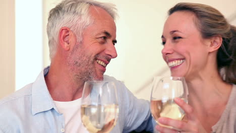 Happy-couple-drinking-white-wine-together