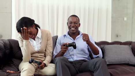 Couple-playing-video-games-on-the-couch-after-work