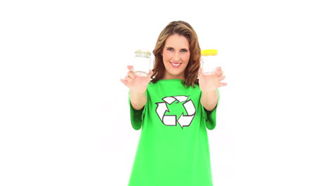 Smiling-environmental-activist-showing-jars