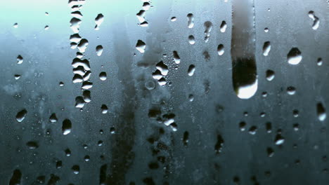 Raindrop-running-down-steamy-glass