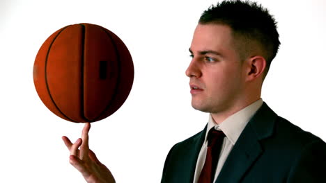 Businessman-spinning-basketball-on-finger