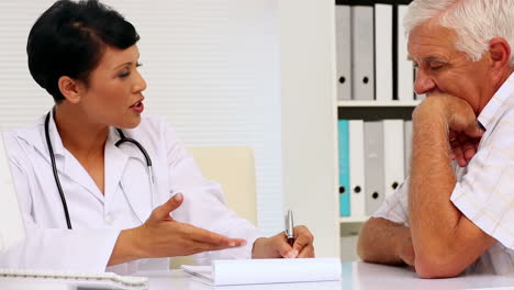 Doctor-asking-a-reluctant-patient-to-sign-a-contract