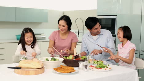 Happy-family-having-dinner-together