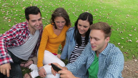 Students-taking-a-selfie-on-the-grass