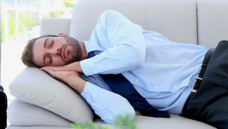 Businessman-sleeping-on-the-couch