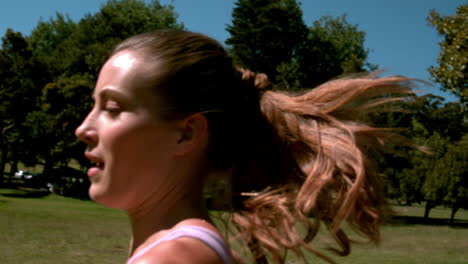 Fit-woman-sprinting-past-the-camera