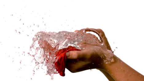 Woman-popping-a-red-water-balloon