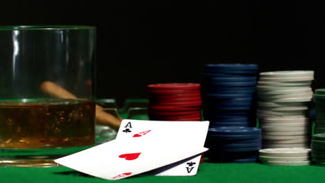 Pair-of-aces-falling-on-casino-table