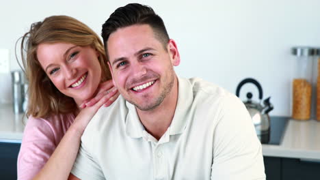 Happy-couple-smiling-at-the-camera