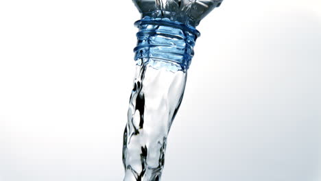 Plastic-bottle-pouring-out-water-on-white-background