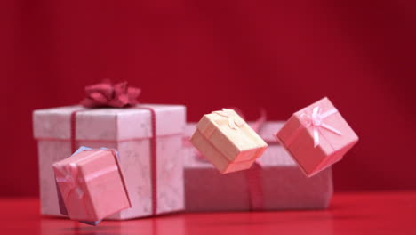 Presents-falling-and-bouncing-on-red-background