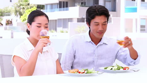 Asian-couple-having-white-wine-with-their-meal