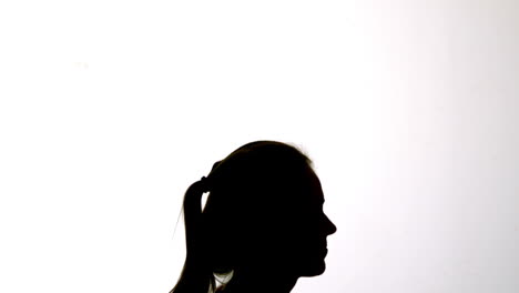 Silhouette-of-attractive-woman-bouncing