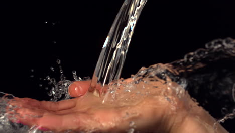 Water-pouring-over-female-hand