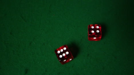 Red-dice-falling-on-casino-table