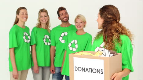 Team-of-environmental-activists-with-one-holding-box