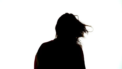 Silhouette-of-attractive-woman-shaking-her-hair