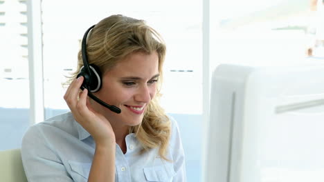 Casual-call-centre-worker-working-at-her-desk