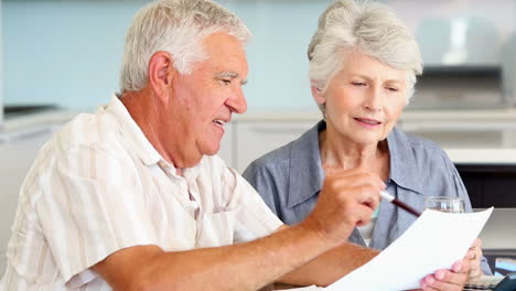 Senior-couple-paying-their-bills