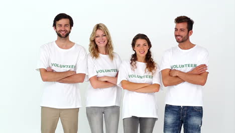 Team-of-volunteers-smiling-at-camera