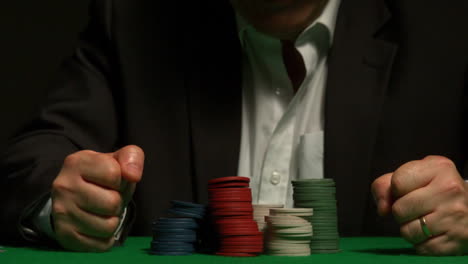 Angry-gambler-slamming-his-hands-on-the-table