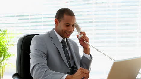 Happy-businessman-talking-on-the-phone