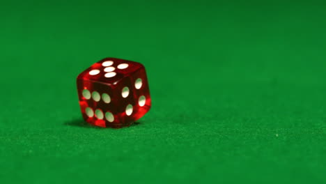 Red-dice-spinning-on-casino-table