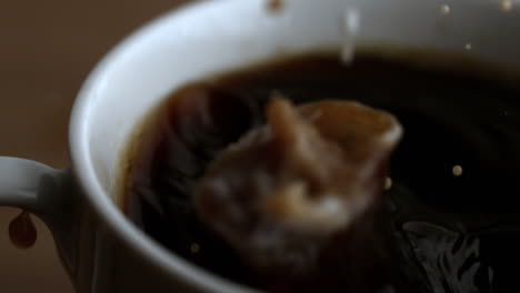 Milk-drop-falling-into-coffee-cup