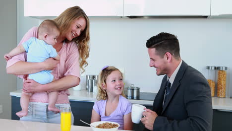 Happy-family-having-breakfast-together-in-the-morning