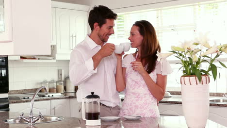 Happy-couple-having-coffee-in-the-morning