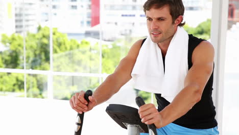 Fit-man-working-out-on-exercise-bike